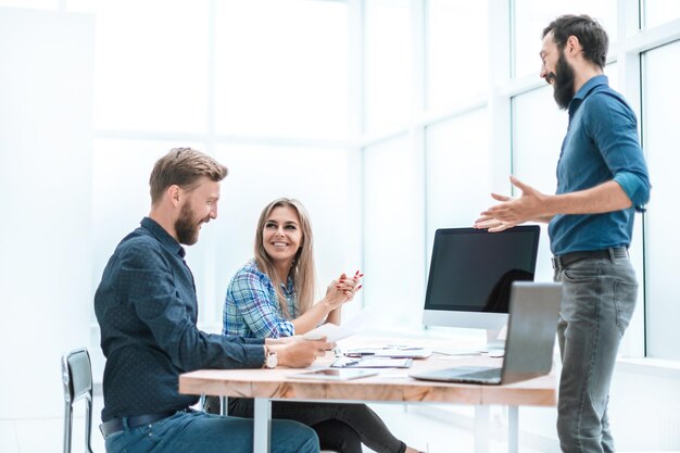 Photo agency staff talking to the client in the office