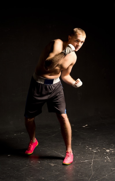 Agile young boxer moving around in the ring