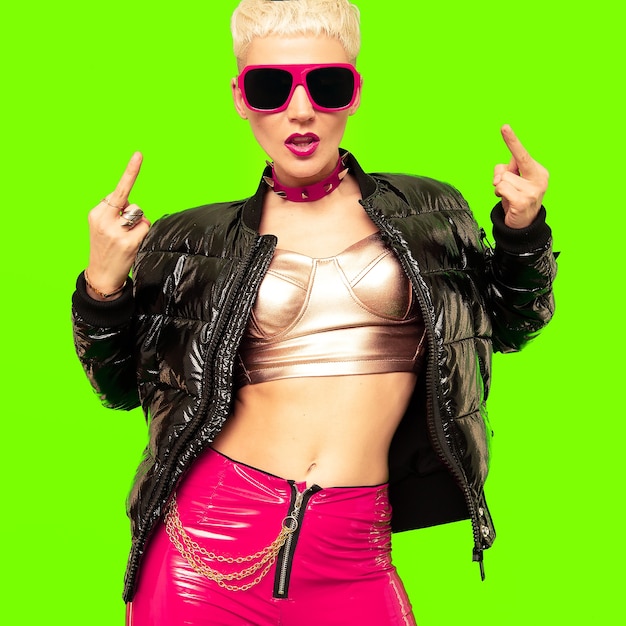 Agressive blonde short hair in fashion clothes and accessories. Clubbing party style