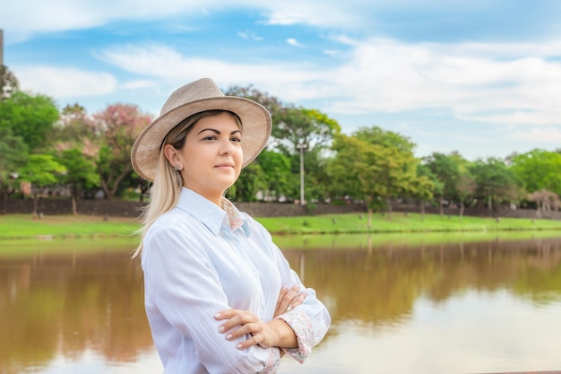 Agribusiness woman wearing hat and jeans at the end of a working dayxA