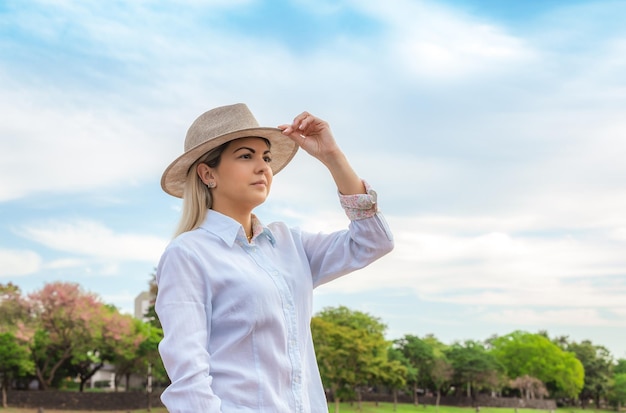 Agribusiness woman wearing hat and jeans at the end of a working dayxA