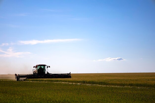 Photo agricultural machinery in operation in the fields. a new trend in technology.