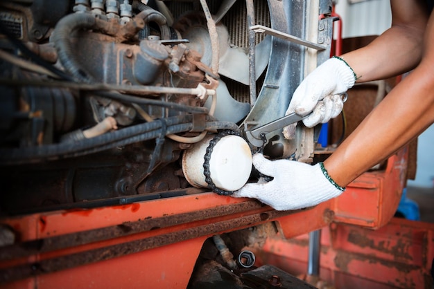 Agricultural tractor repairman in Asia