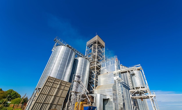 Agriculture concept. Metal constructions for keeping dry wheat or other cereals. Modern steel concstructions.