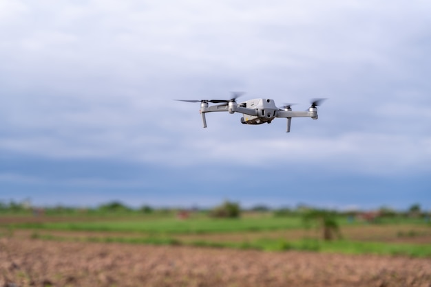 Agriculture drone flight farmland survey in field