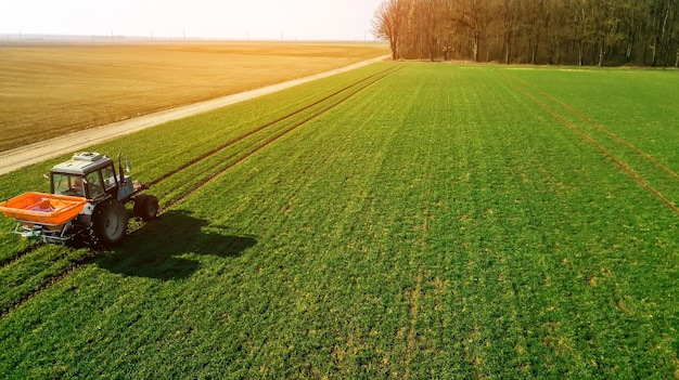 Agriculture shooting with quadrocopter tractor on the field