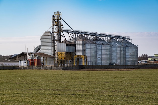 Agro silos granary elevator on agroprocessing manufacturing plant for processing drying cleaning and storage of agricultural products flour cereals and grain