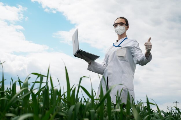 Agronomist using tablet and technology in agricultural corn field The farmer walks through