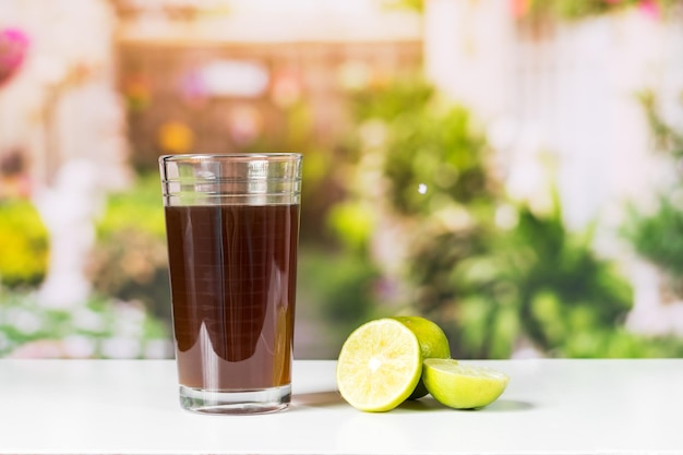 Agua de panela and lemon or candies made from sugar cane and lemon in nature typical food of Colombia