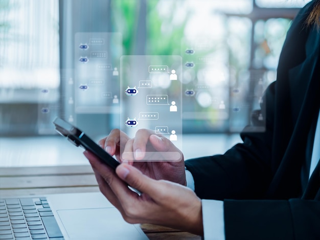 写真 ai チャット ボット技術の概念 手のスマート携帯電話画面上のロボットとの会話チャット パネル ロボット アプリケーション アシスタント自動サービスによる人工知能技術