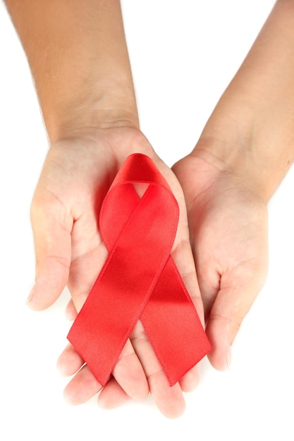 AIDS ribbon in hands isolated on white