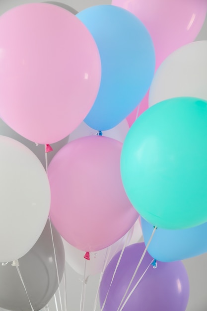 Air balloons on light background, closeup