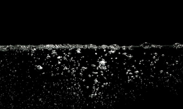 Air bubbles water on black background