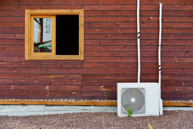 Air conditioner block on wall of building outdoors