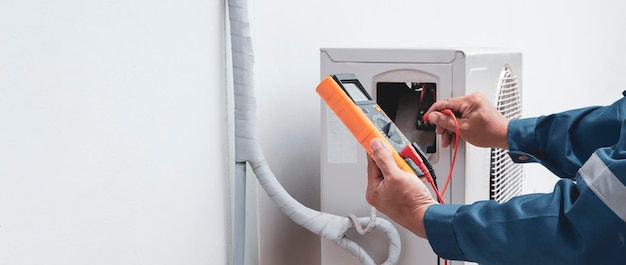 Air conditioner technician checking air conditioner operation.