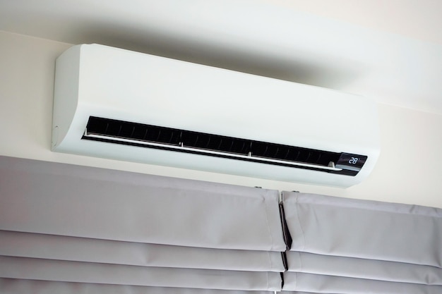 Photo air conditioner on white wall room interior background