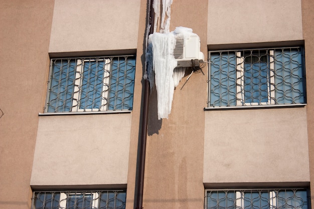 Air conditioner with frozen ice and icicles
