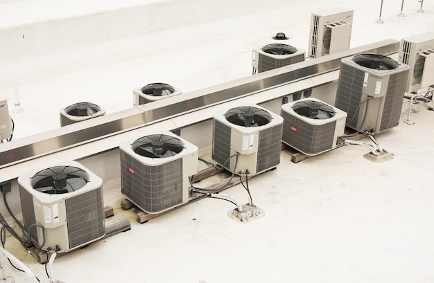 Photo air conditioners are shown on a white surface.