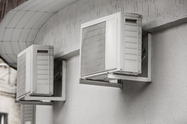 Air conditioners on wall of building outdoors