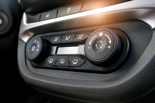 Air conditioning button inside a car Climate control unit in the new car Modern car interior details Car detailing Selective focus