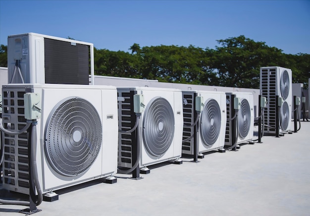 Photo air conditioning hvac on the roof of an industrial building with blue sky and clouds