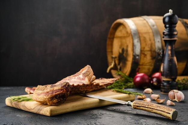 Air dried lamb ribs on wooden cutting board