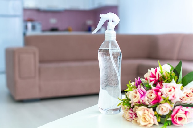 Air freshener on table for pleasant fresh floral smell in room at home