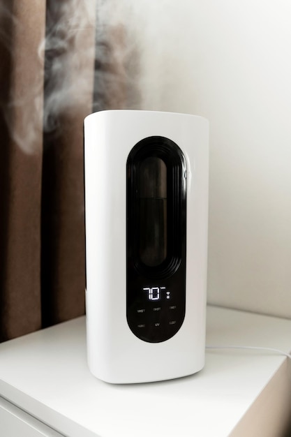 The air humidifier is in the room on the nightstand next to the bed smart humidifier with wifi and remote control electronic control panel