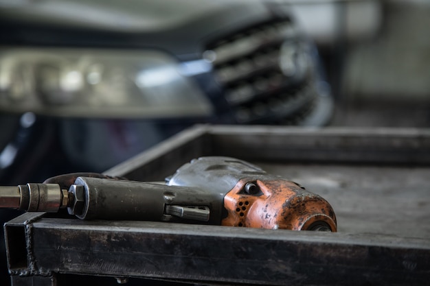 Photo air impact wrench in service shop repairing