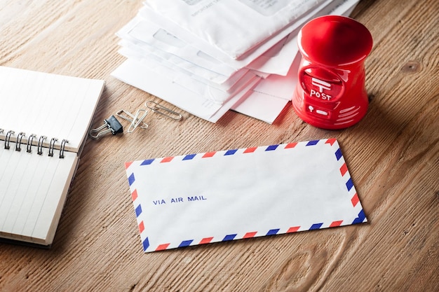 Air mail envelope on the wood table