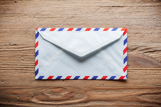 Air mail envelope on the wood table