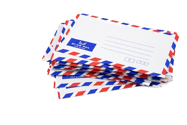 Air mail letter stack on white background.