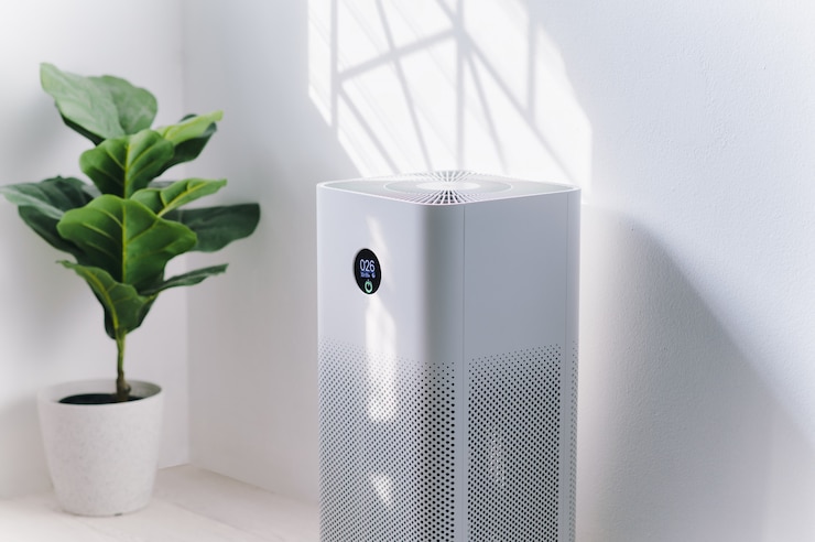 Photo air purifier a living room,  air cleaner removing fine dust in house
