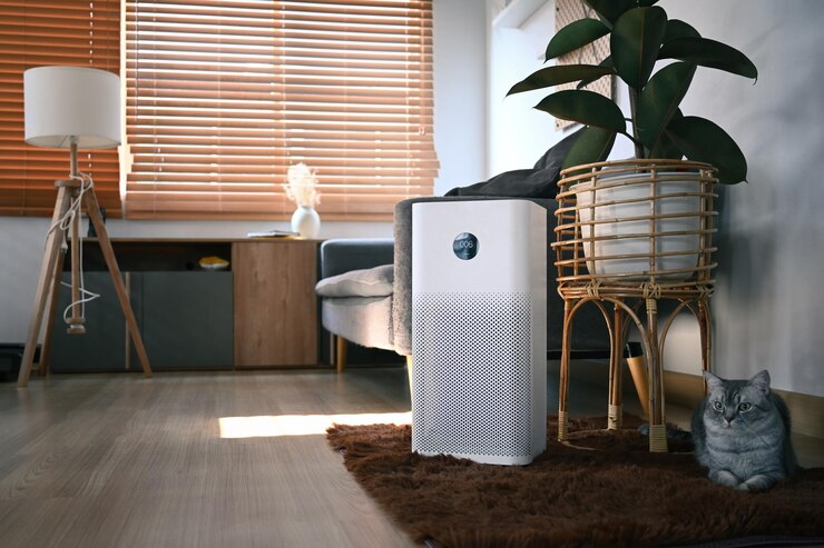 Photo air purifier with lovely cat and houseplant on wooden floor in living room air pollution concept
