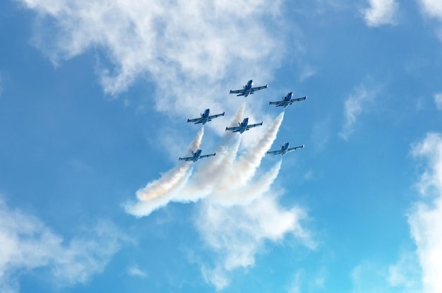 Aircraft fighter jets smoke the background of sky clouds