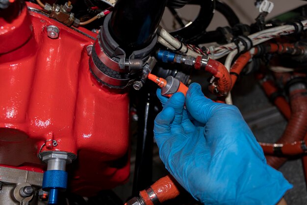 Photo aircraft maintenance technician making a torque stripe