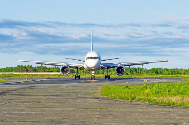 Aircraft on the runway is a front view of the engine and chassis