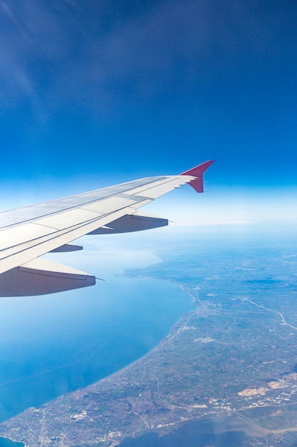 Aircraft wing on the clouds