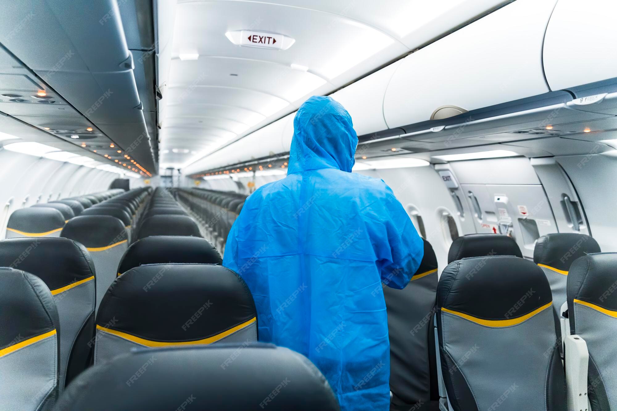 Premium Photo Airline staffs in protective suit (ppe) wearing medical