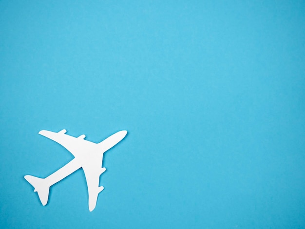 An airliner on a blue background The concept of travel rest and flight