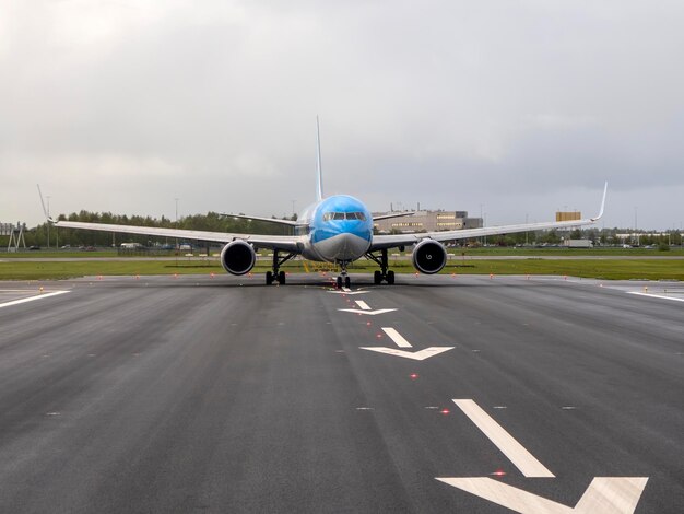 airplaine on take off runway airstrip in Schipol Airport