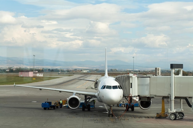 Airplane at airport with blue sky background