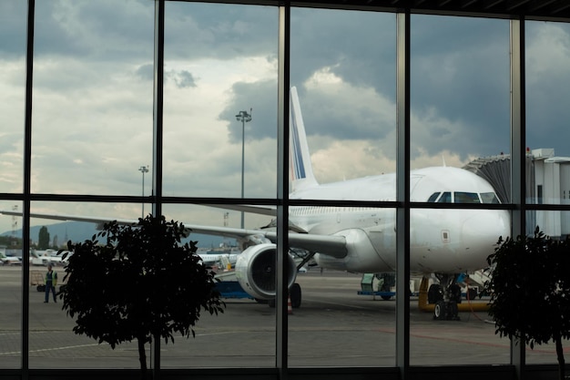 Airplane at airport with blue sky background