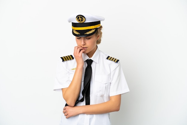Airplane blonde woman pilot isolated on white background having doubts