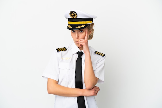 Airplane blonde woman pilot isolated on white background thinking an idea