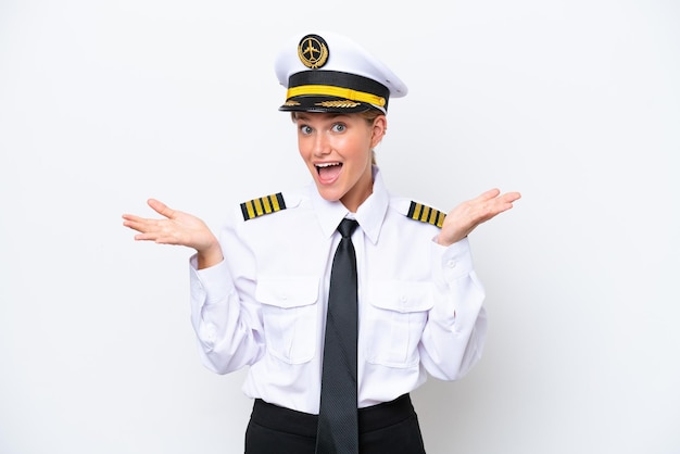 Airplane caucasian pilot woman isolated on white background with shocked facial expression