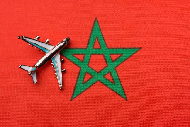 Airplane over the flag of Morocco the concept of travel