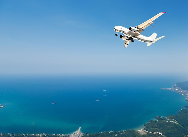 Airplane flies over sea