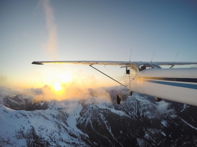 Airplane flying over the Canadian Mountain Landscape