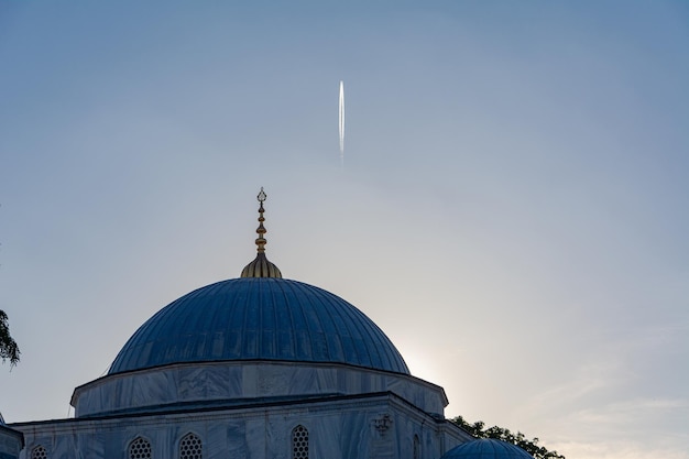 Airplane flying over Mosque Istanbul Turkey